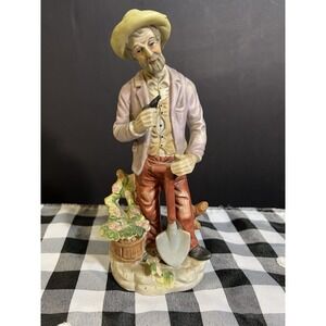 VTG UCGC MAN HOLDING‎ PIPE WITH A SHOVEL"FARM LIFE" 8.5" T (2097)